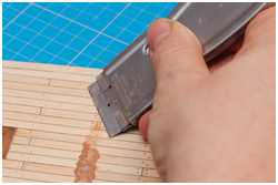 Wachsreste mit Ziehklinge entfernen