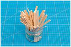 mit Pappe beklebte Leisten