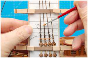 Knoten mit Lack fixieren