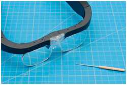 Lupenbrille und Hohlspieker